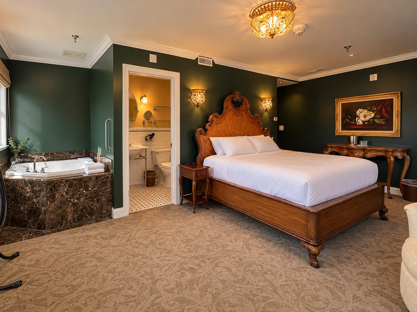 A king room in deep green with a marble-set jetted tub